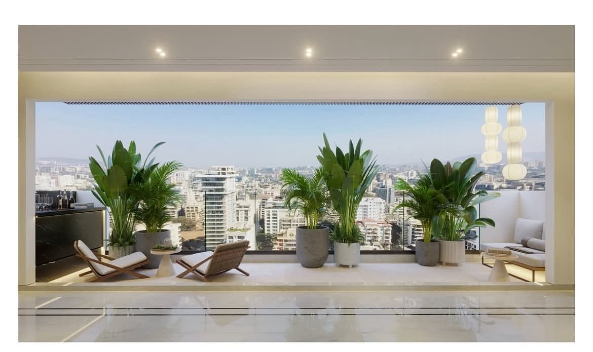 High-rise living room framed with potted plants at dusk