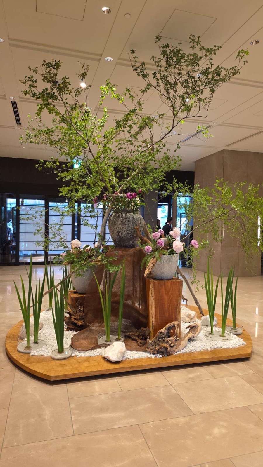 Sculptural branch and foliage installation in a lobby